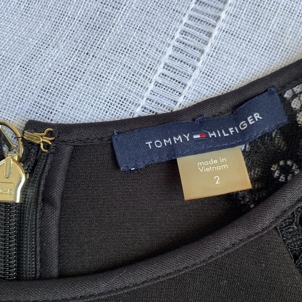 Tommy Hilfiger little black dress with long sleeves lace sleeves.